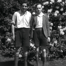 Two boys in front of a rhododendron.jpg